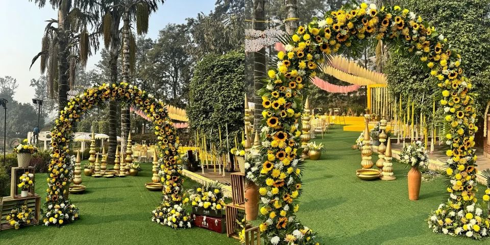 Floral arch and ceremonial seating on a lawn