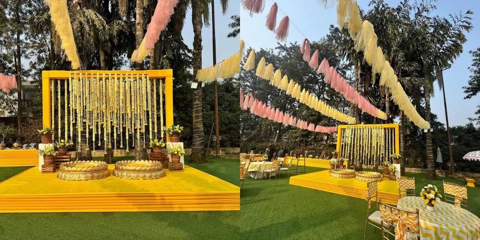 Lawn celebration setting with colourful suspended fabric