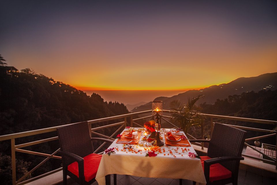 Dinner table overlooking the hills at sunset