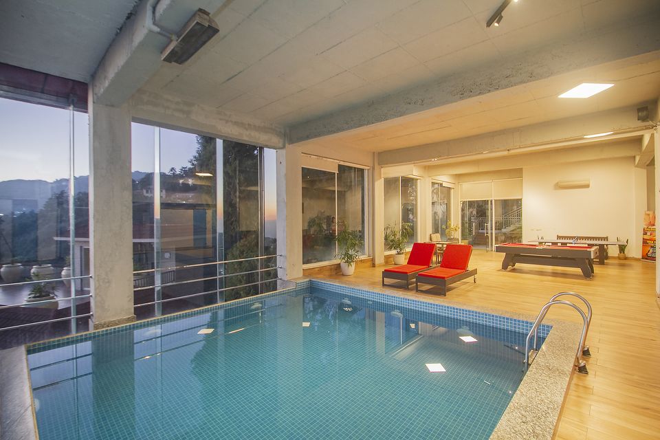 Indoor swimming pool with panoramic windows